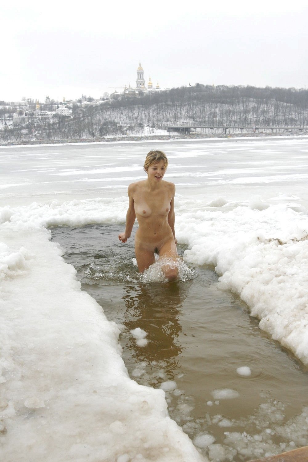 Naked women bathe in the hole