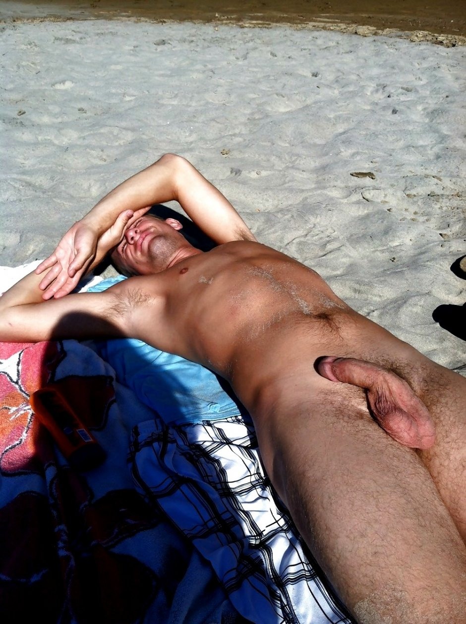 The guy has a beautiful cock on the beach