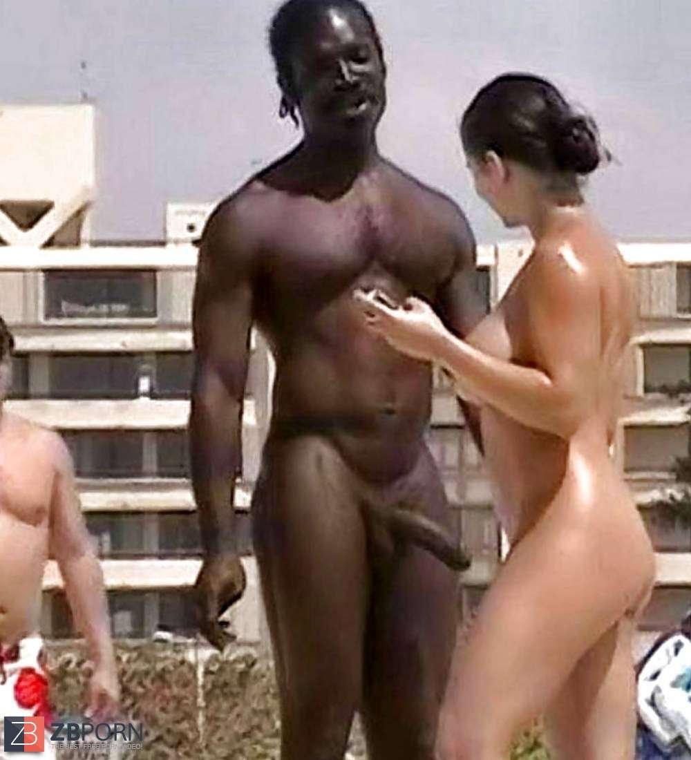 Negro with a huge member on the beach