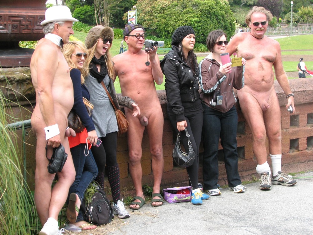 Naked women among dressed men