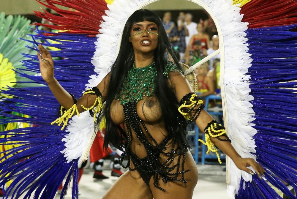 Naked women in carnival costumes