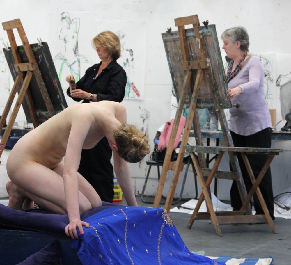 Naked model and artists