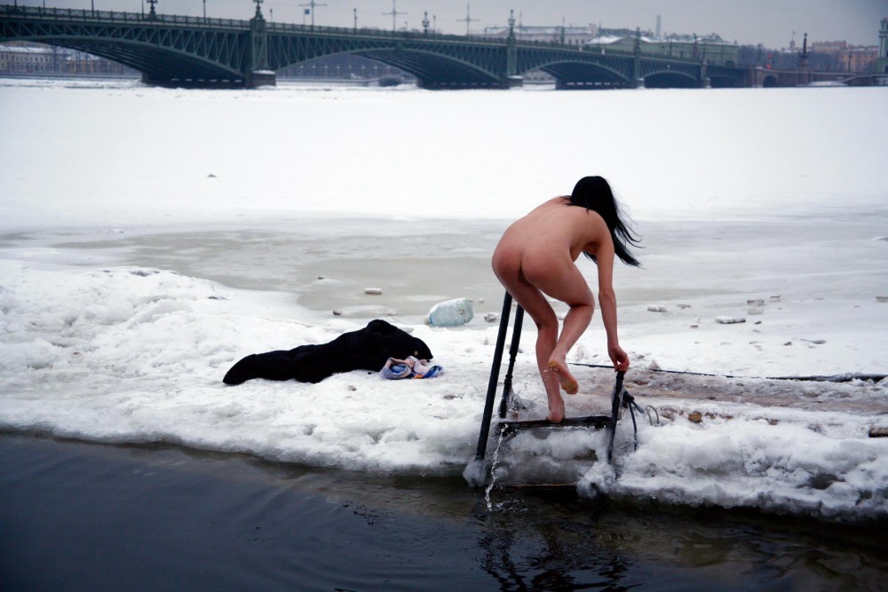 Naked women bathe in the hole