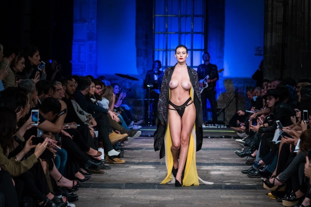 Naked fashion model on the catwalk