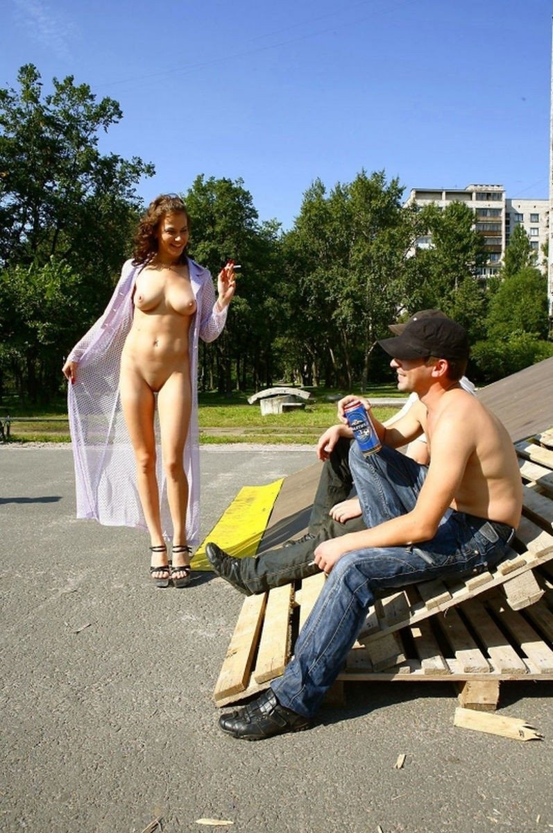 Naked girls walk along the street
