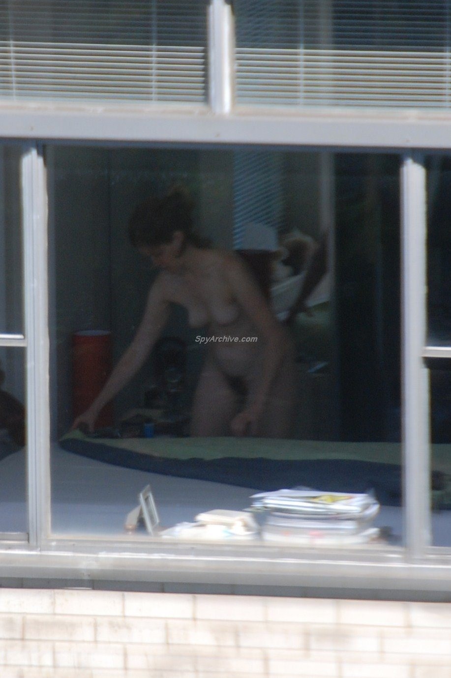 Naked woman through the window