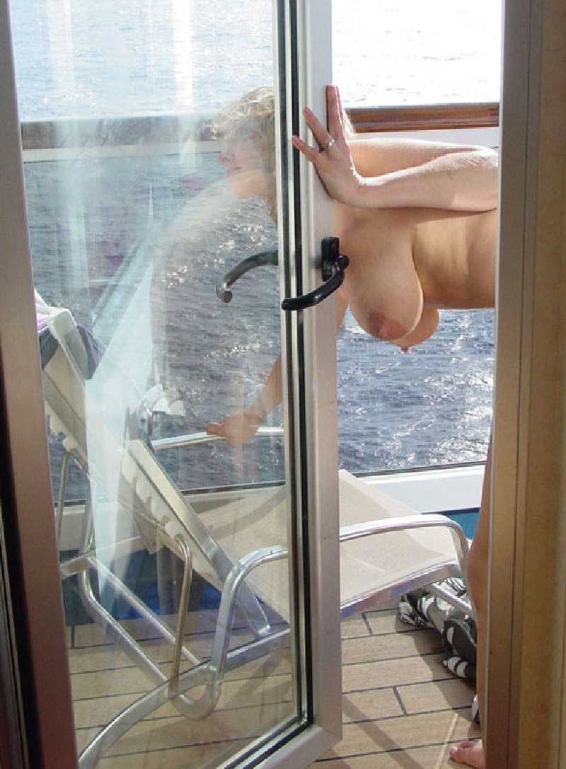 Peeping out the window behind the neighbor