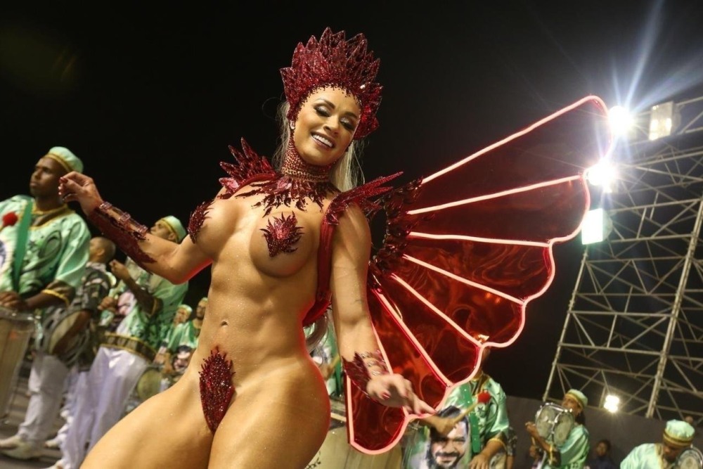 Naked women in carnival costumes