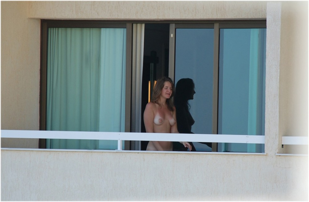 Naked woman in the window opposite
