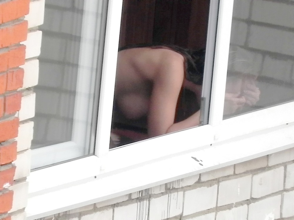 Naked in the window lit up