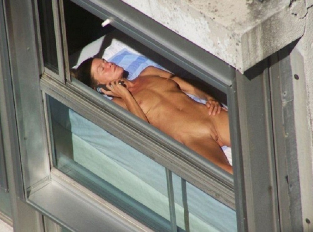 Naked woman through the window