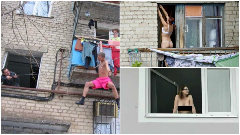 The girl undresses in the window
