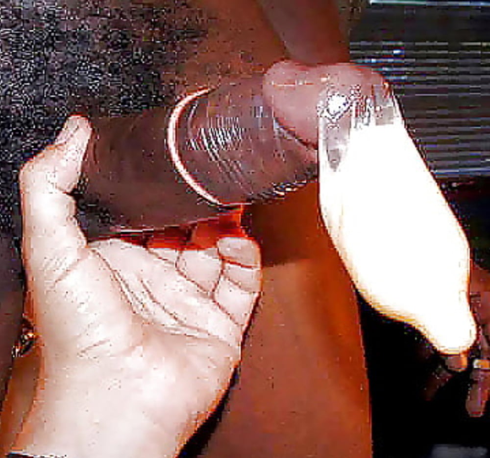 A man cums in a condom