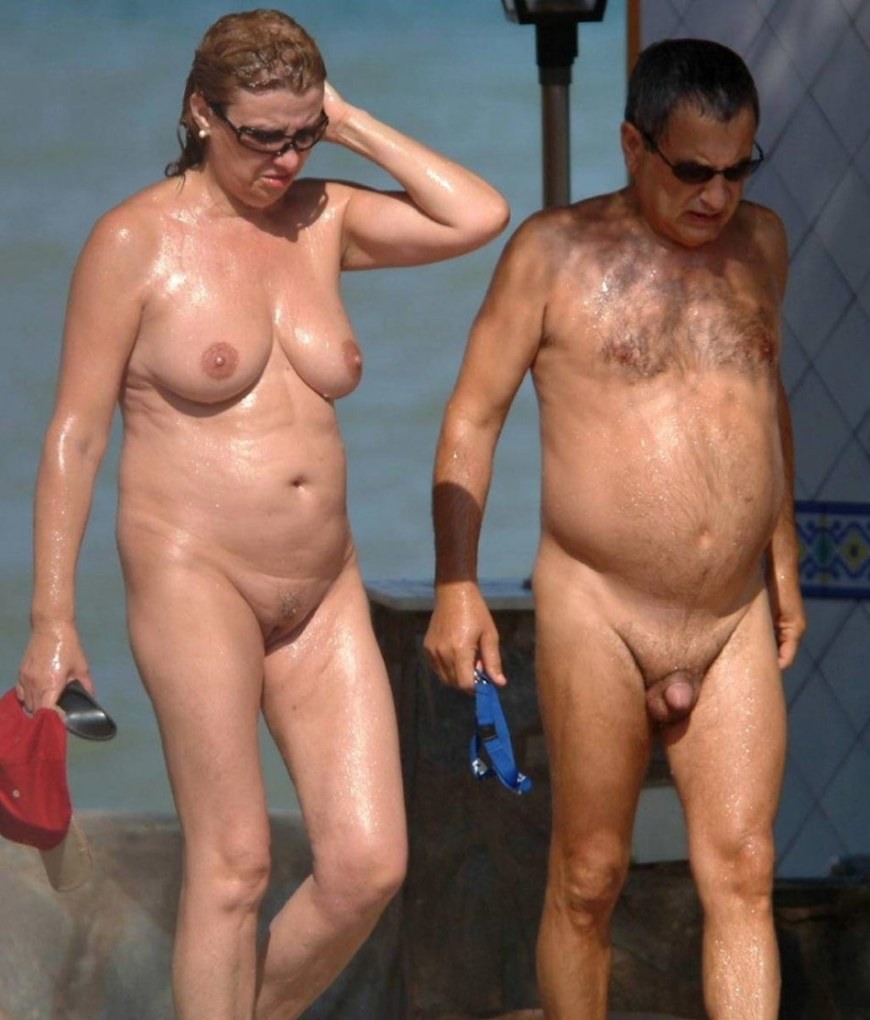 Naked elderly women and men on the beach