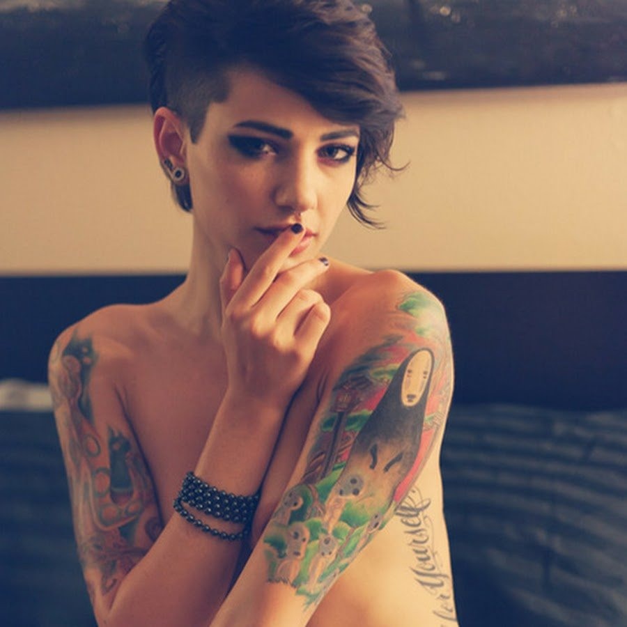 Girl with short haircut and tattoo