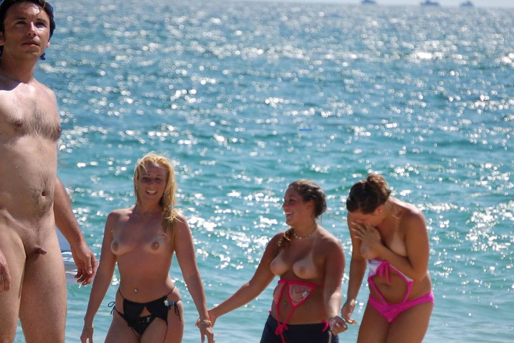 Naked men on a public beach