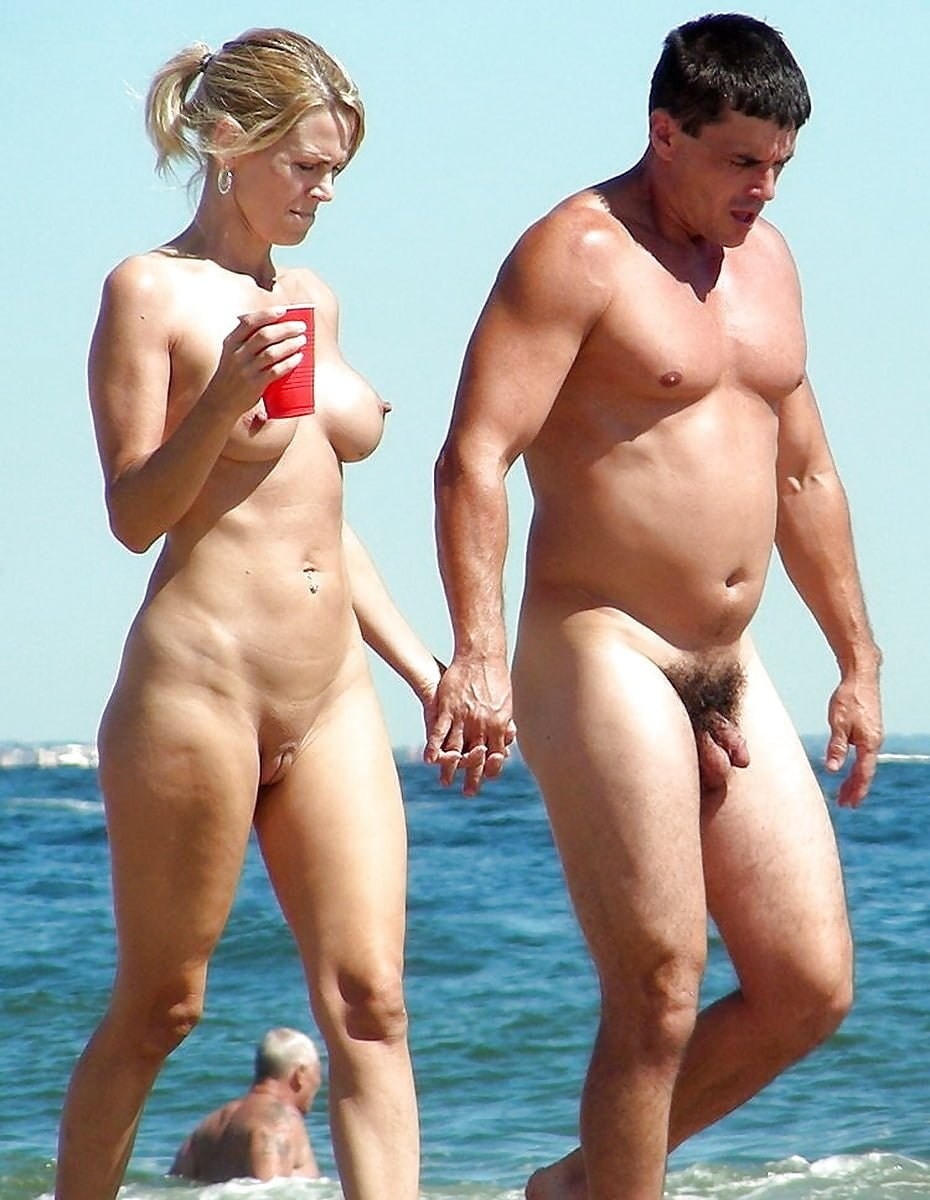 Naked pairs with an erection on the beach