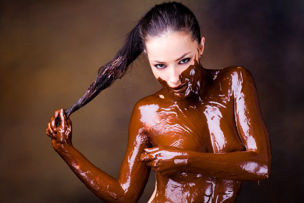 The girl coated with chocolate