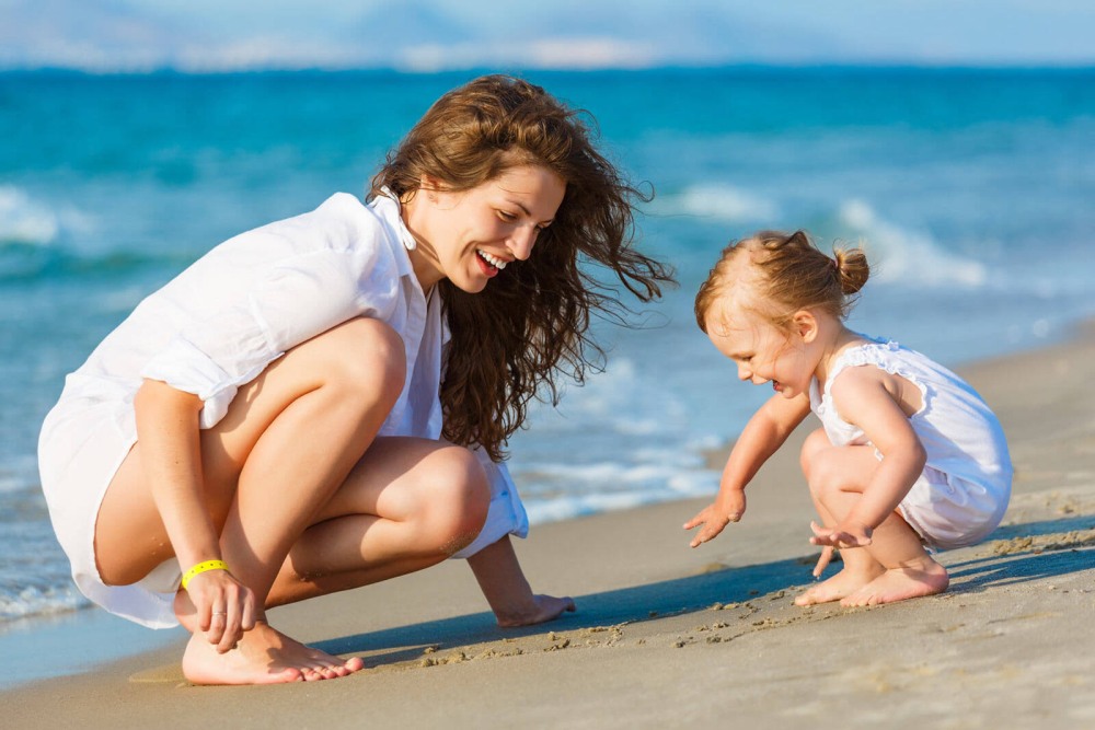 Mother and child on the beach